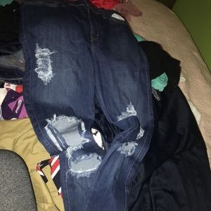 Woman’s jeans with holes in them